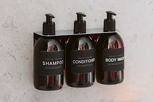 Base soap pump holder shower in chrome mounted on a wall