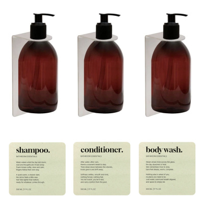 soap pump set with brown pump bottle, base soap pump holder, and labels in beige color